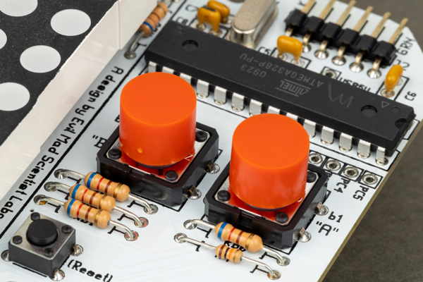 Tactile push button switches on a circuit board