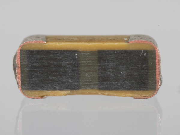 Cross section through a multilayer ceramic capacitor (Outtake)